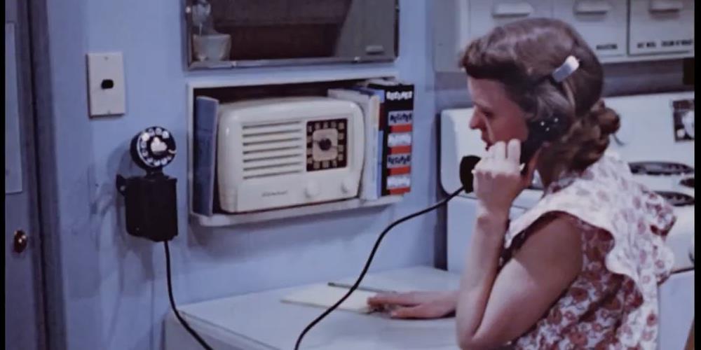 Homemaker on Telephone in the Step-Saving Kitchen