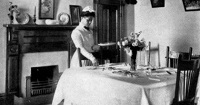 woman setting dining table