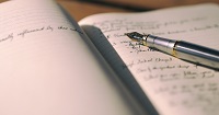 Pen atop ledger